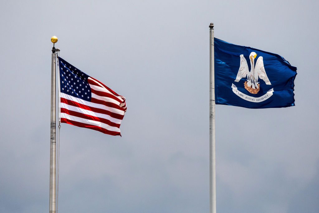 METAIRIE, LA - JUNE 25: The American Flag and Louisiana State Flag waving in the breeze during the minor league game between the Colorado Springs Sky Sox and the New Orleans Baby Cakes on June 25, 2017 at Zephyr Field in Metairie, LA. New Orleans Baby Cakes won 7-1. (Photo by Stephen Lew/Icon Sportswire via Getty Images)