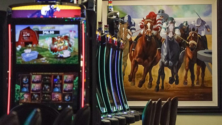 FILE - This March 5, 2015 file photo shows video gaming terminals known as instant horse racing at Les Bois Park in Garden City, Idaho. Such machines are now banned in Idaho, but a new ballot initiative, Proposition 1, has been filed to legalize the machines. An Idaho group made up of state and local political leaders have launched a statewide effort to oppose thea ballot initiative seeking to legalize so-called "historical horse racing." The group, known as Idaho United Against Prop 1, announced Wednesday, Sept. 5, 2018, it was releasing TV and radio ads urging Idahoans to vote no on the ballot initiative in November. (AP Photo/Otto Kitsinger, File)