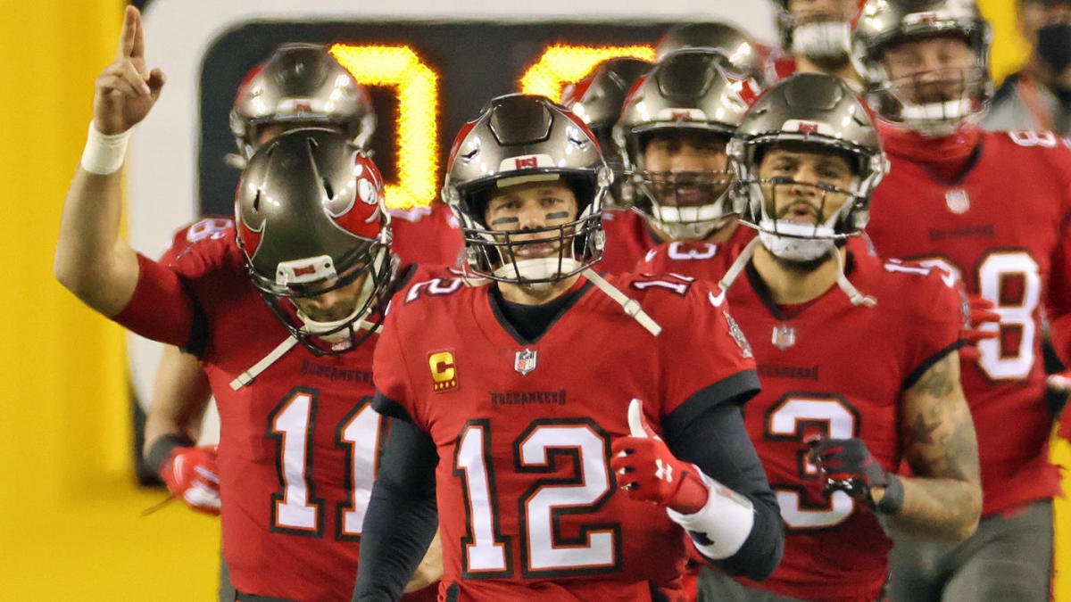 Jan 9, 2021; Landover, Maryland, USA; Tampa Bay Buccaneers quarterback Tom Brady (12) leads his team onto the field prior to their game against the Washington Football Team at FedExField. Mandatory Credit: Geoff Burke-USA TODAY Sports