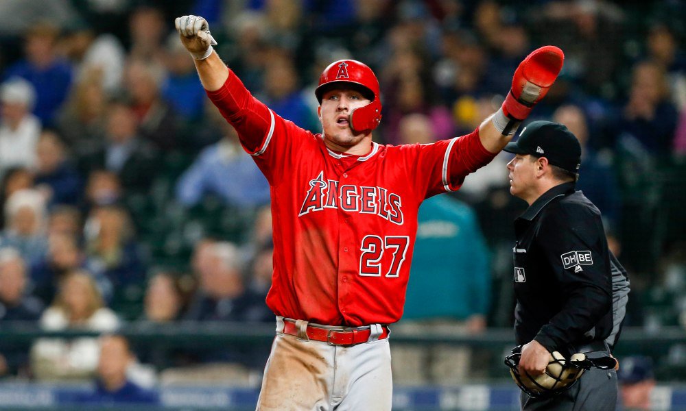May 5, 2018; Seattle, WA, USA; Los Angeles Angels center fielder Mike Trout (27) reacts after scoring a run against the Seattle Mariners during the eleventh inning at Safeco Field. Mandatory Credit: Joe Nicholson-USA TODAY Sports ORG XMIT: USATSI-375164 ORIG FILE ID:  20180504_pjc_sn8_738.JPG