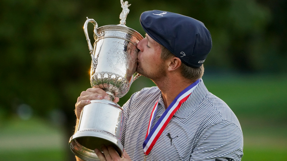 Bryson DeChambeau, of the United States, kisses the winner's trophy after winning US Open Golf Championship, Sunday, Sept. 20, 2020, in Mamaroneck, N.Y. (AP Photo/John Minchillo) ORG XMIT: USO520