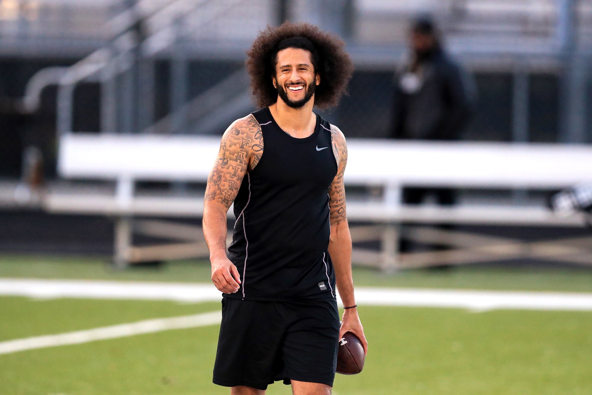 RIVERDALE, GA - NOVEMBER 16: Colin Kaepernick looks on during the Colin Kaepernick NFL workout held at Charles R. Drew High School on November 16, 2019 in Riverdale, Georgia. (Photo by Carmen Mandato/Getty Images)