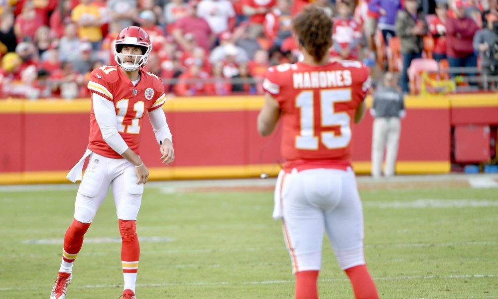 Nov 26, 2017; Kansas City, MO, USA; Kansas City Chiefs quarterback Alex Smith (11) throws passes to quarterback Patrick Mahomes (15) on the sidelines during the second half against the Buffalo Bills at Arrowhead Stadium. Mandatory Credit: Denny Medley-USA TODAY Sports