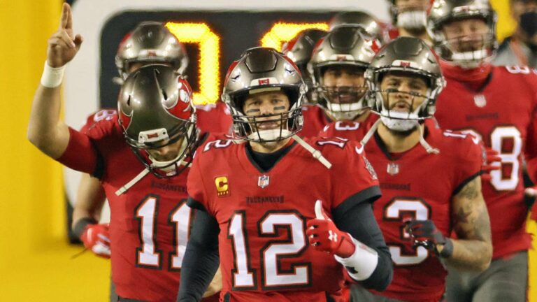 Jan 9, 2021; Landover, Maryland, USA; Tampa Bay Buccaneers quarterback Tom Brady (12) leads his team onto the field prior to their game against the Washington Football Team at FedExField. Mandatory Credit: Geoff Burke-USA TODAY Sports