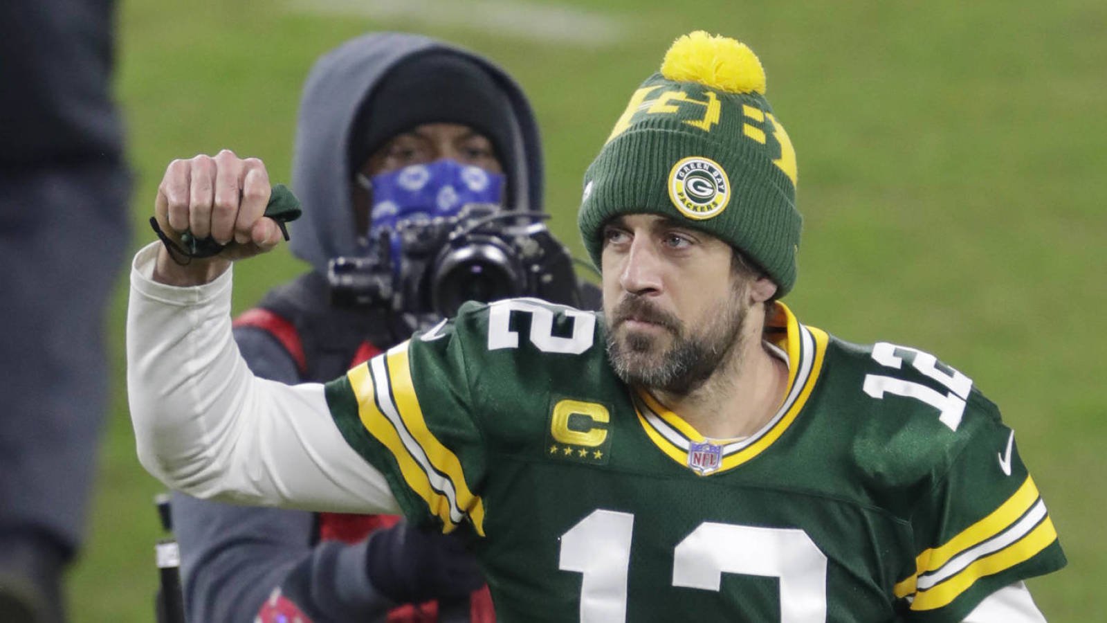 Jan 16, 2021; Green Bay, WI, USA;  Green Bay Packers quarterback Aaron Rodgers (12) celebrates a victory against the Los Angeles Rams during their NFL divisional playoff game Saturday, January 16, 2021, at Lambeau Field in Green Bay, Wis.  Mandatory Credit: Dan Powers-USA TODAY NETWORK